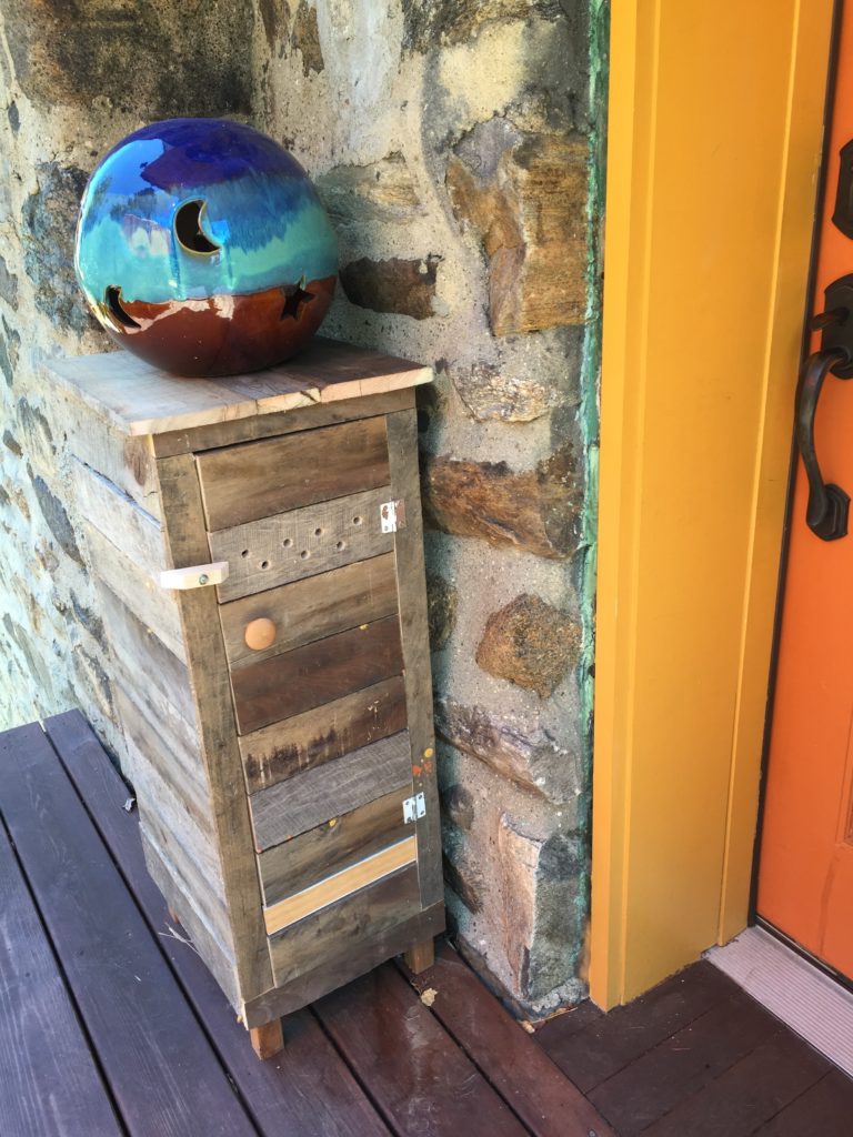 Cabinet made from recycled wood, door closed